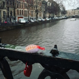 Ebijiro and the heart lock on a canal in Amsterdam.