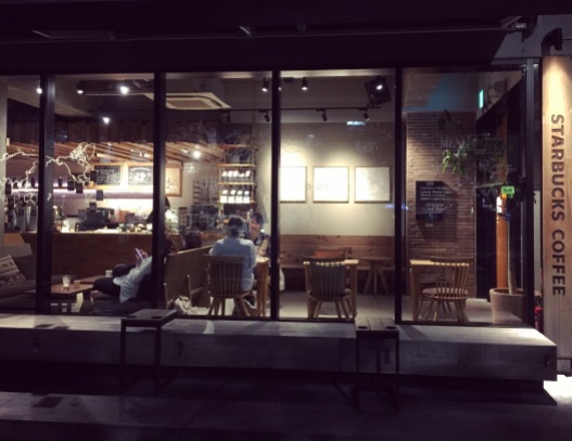 Night view of Starbucks 2-Chome branch and Crescent Moon inside.